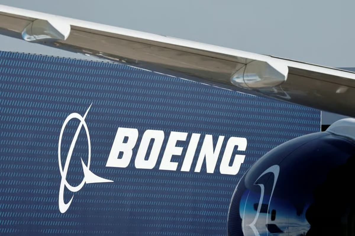 Close-up of the Boeing logo on an aircraft tail and wing