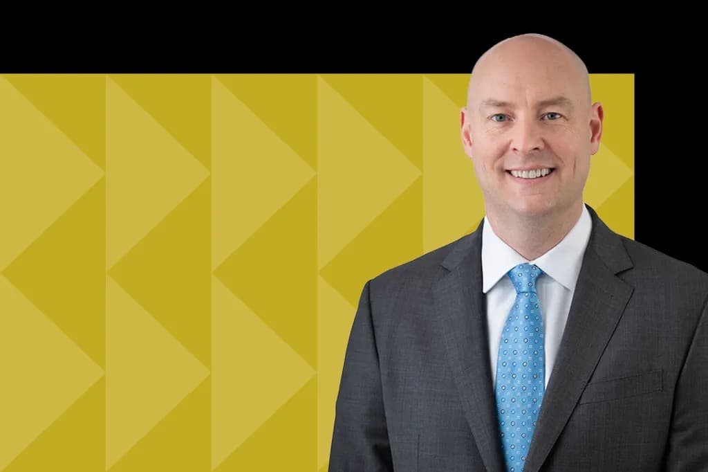William K. Grogan, incoming CFO of GE HealthCare Technologies, smiling in a portrait