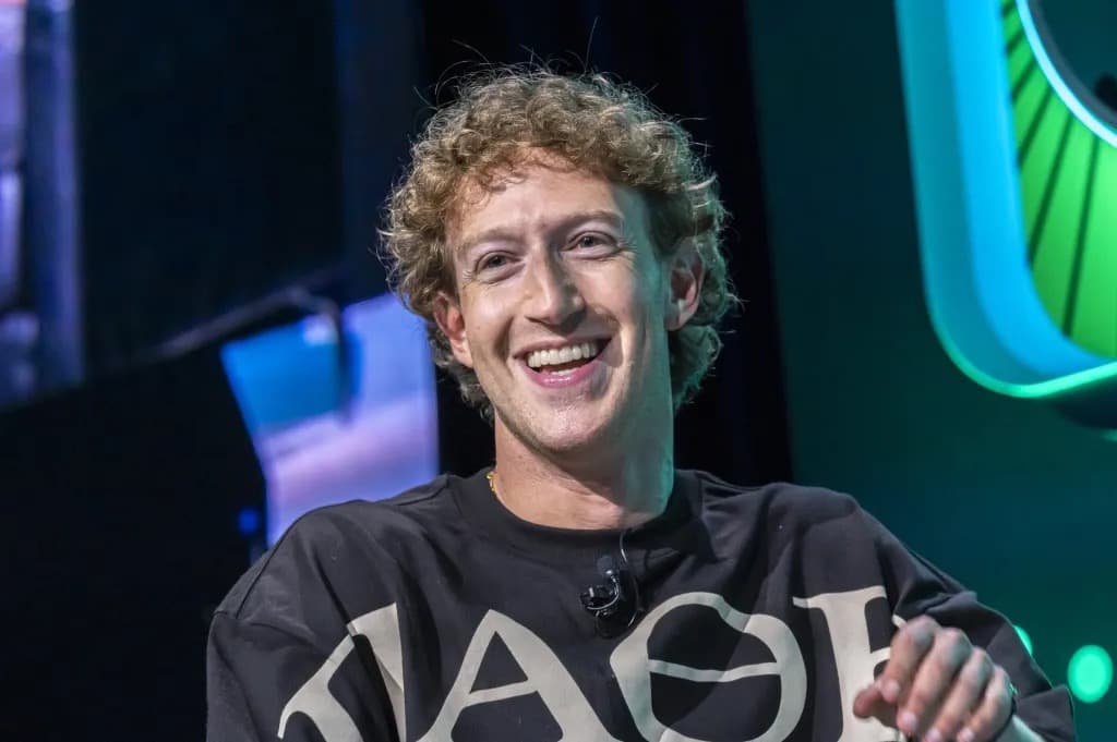 Mark Zuckerberg smiling on stage during an event